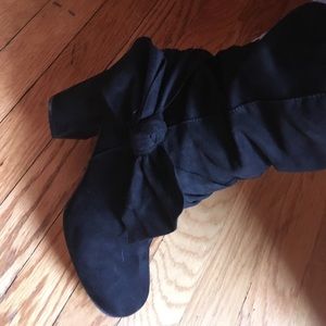 Above the knee black boots